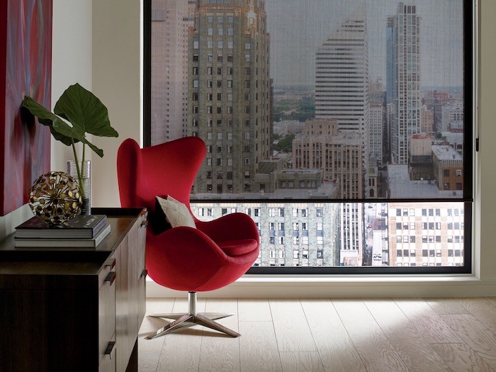 A living room with sculptural chair.